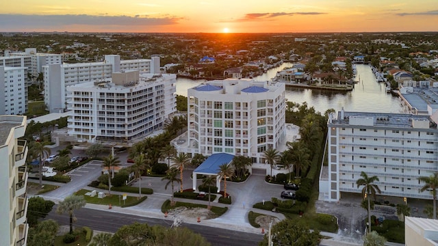 aerial view at dusk with a water view