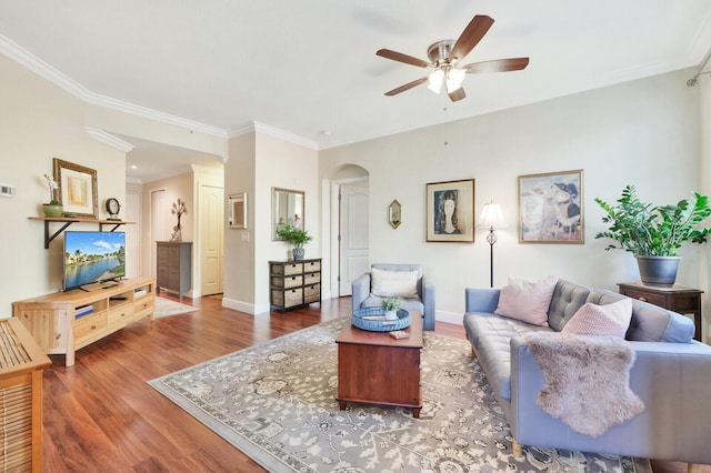 living room with crown molding, hardwood / wood-style flooring, and ceiling fan