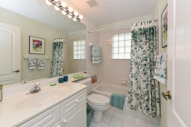 full bathroom featuring shower / bath combination with curtain, vanity, toilet, and tile patterned flooring