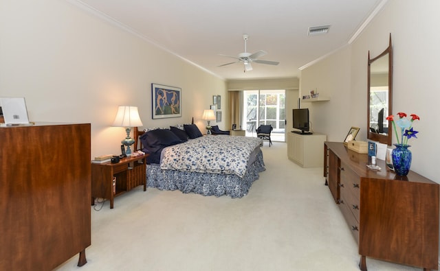 bedroom featuring ornamental molding, light colored carpet, and ceiling fan