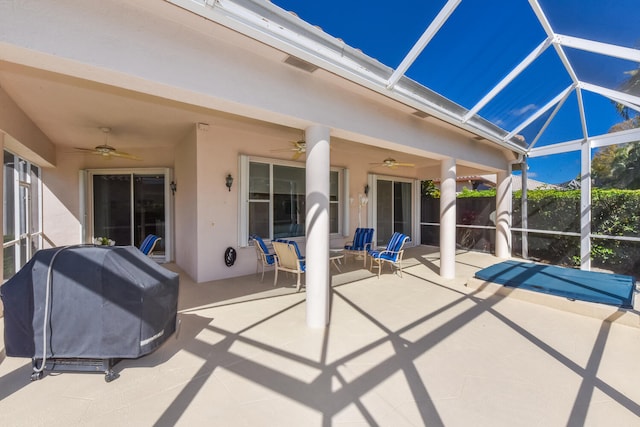 view of patio / terrace featuring a lanai, a grill, and ceiling fan