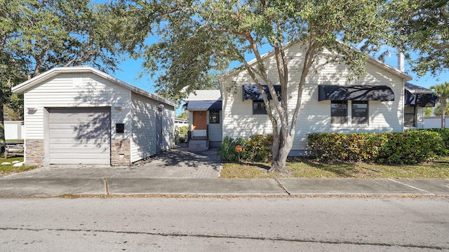 view of front of home featuring a garage and an outdoor structure