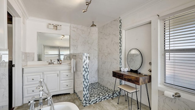 bathroom featuring vanity, crown molding, and tiled shower