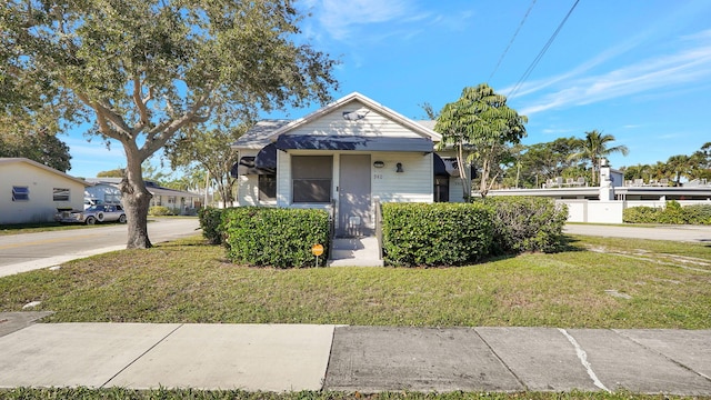 bungalow with a front lawn