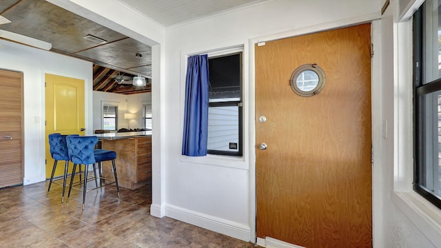 interior space with crown molding