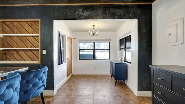 entryway featuring a chandelier, tile patterned floors, and electric panel