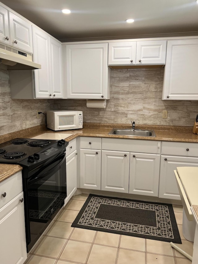 kitchen featuring white cabinetry, sink, electric range, and light tile patterned floors