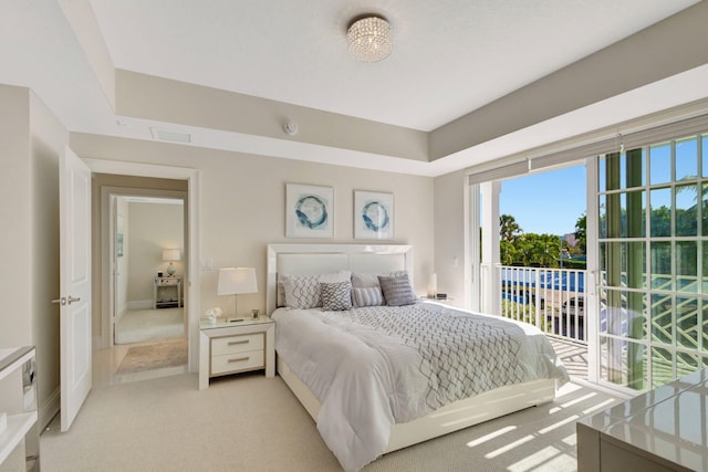 bedroom featuring light colored carpet and access to exterior