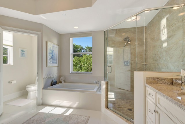 full bathroom with vanity, tile patterned flooring, toilet, and separate shower and tub