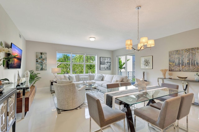 dining room featuring a notable chandelier and light tile patterned flooring