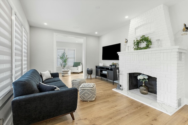 living room featuring hardwood / wood-style floors and a fireplace