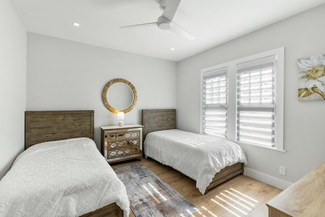 bedroom featuring ceiling fan and hardwood / wood-style floors