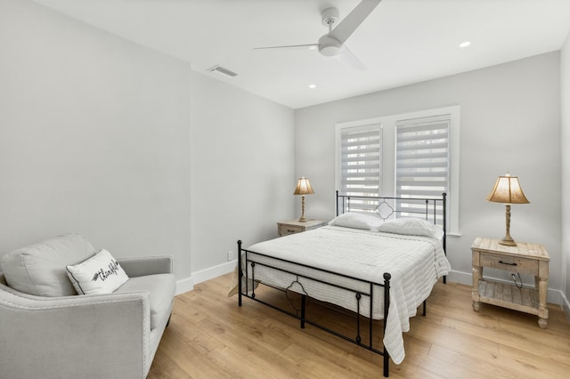 bedroom featuring light hardwood / wood-style floors and ceiling fan