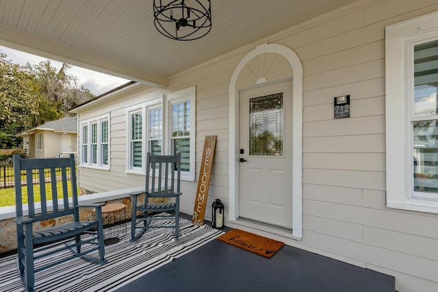 property entrance with covered porch