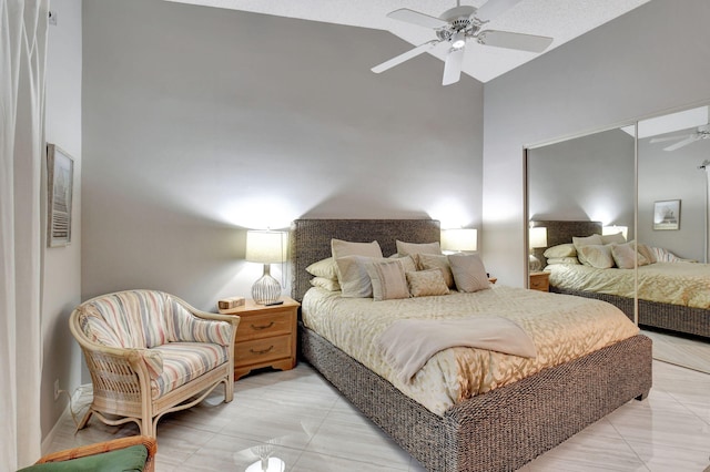 bedroom featuring ceiling fan and a closet