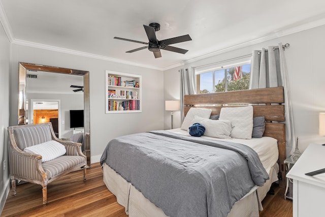 bedroom featuring crown molding, hardwood / wood-style floors, and ceiling fan