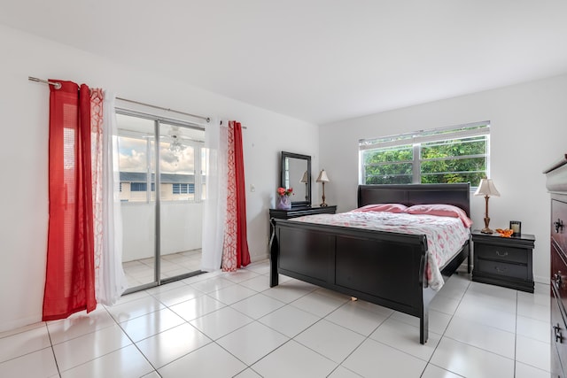 bedroom featuring light tile patterned flooring and access to outside