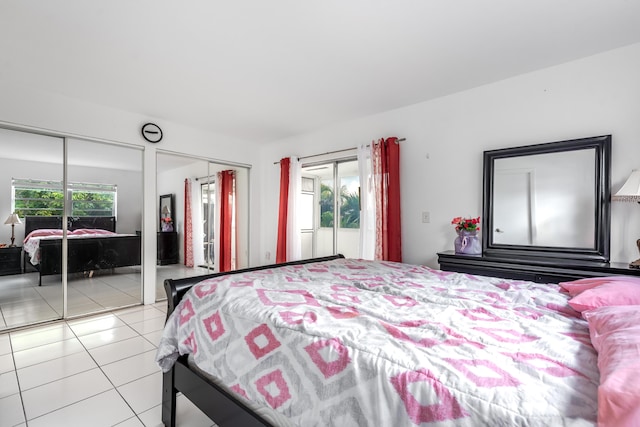 tiled bedroom with multiple closets