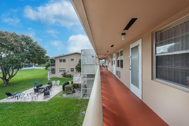 view of yard with a balcony