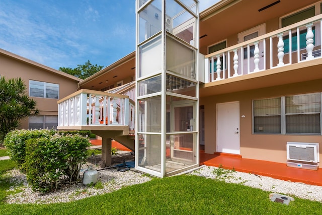 rear view of property featuring heating unit