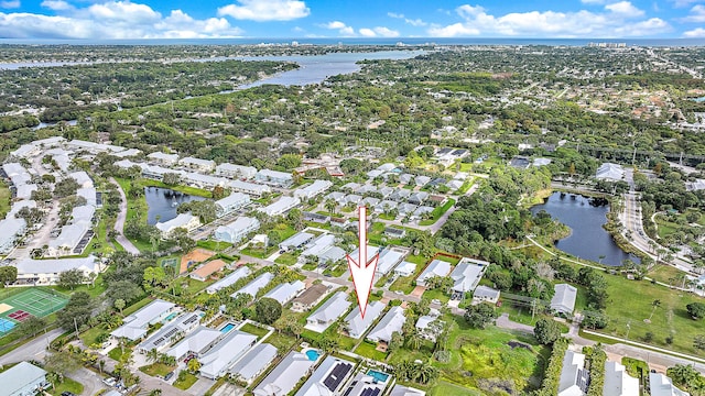 birds eye view of property with a water view