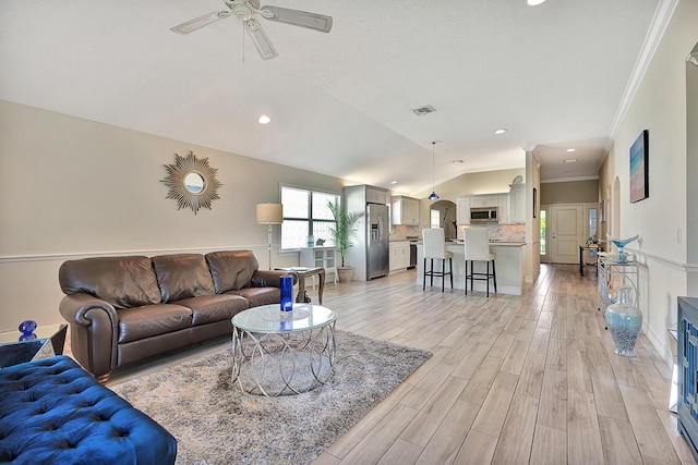 living room with crown molding, recessed lighting, vaulted ceiling, ceiling fan, and light wood-type flooring