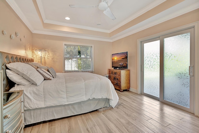 bedroom with crown molding, light hardwood / wood-style flooring, access to outside, a raised ceiling, and ceiling fan