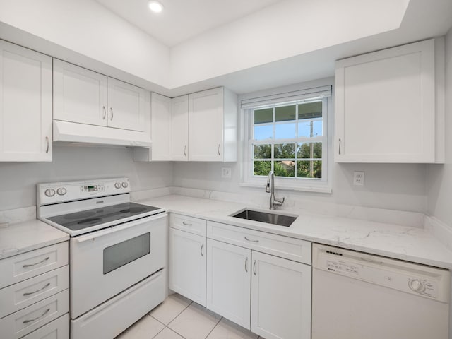 kitchen featuring white cabinetry, white appliances, sink, and light tile patterned floors