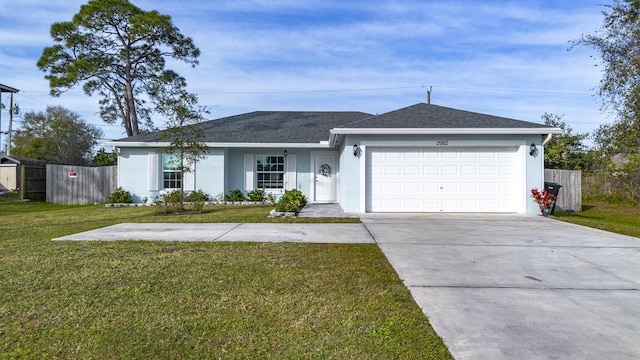 ranch-style home with a garage and a front yard