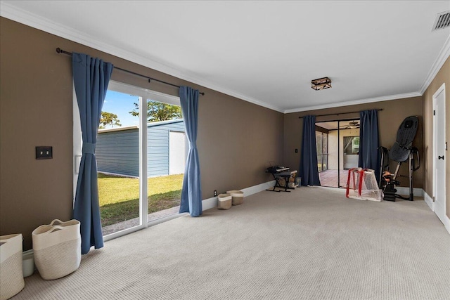 carpeted spare room with crown molding