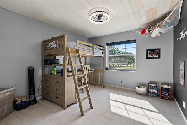 carpeted bedroom featuring wooden ceiling