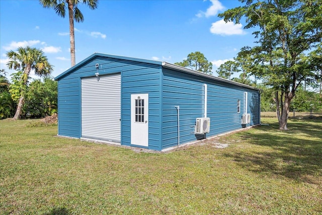 view of outbuilding featuring a yard