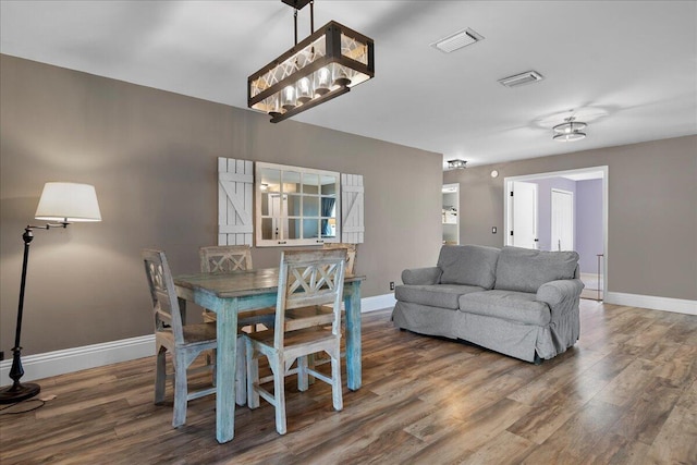 dining area featuring hardwood / wood-style floors