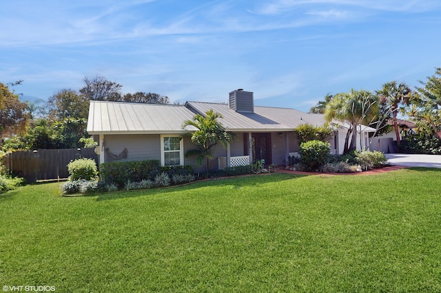 ranch-style home featuring a front yard