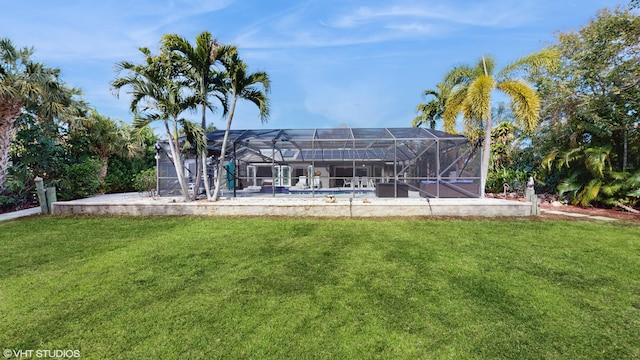 exterior space with a lanai and a lawn