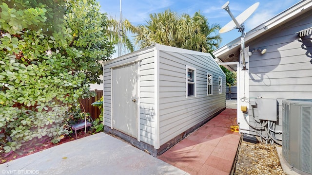 view of outbuilding featuring central AC