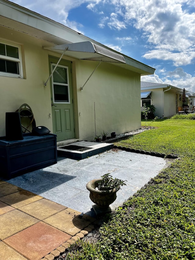 exterior space with a yard and a patio area