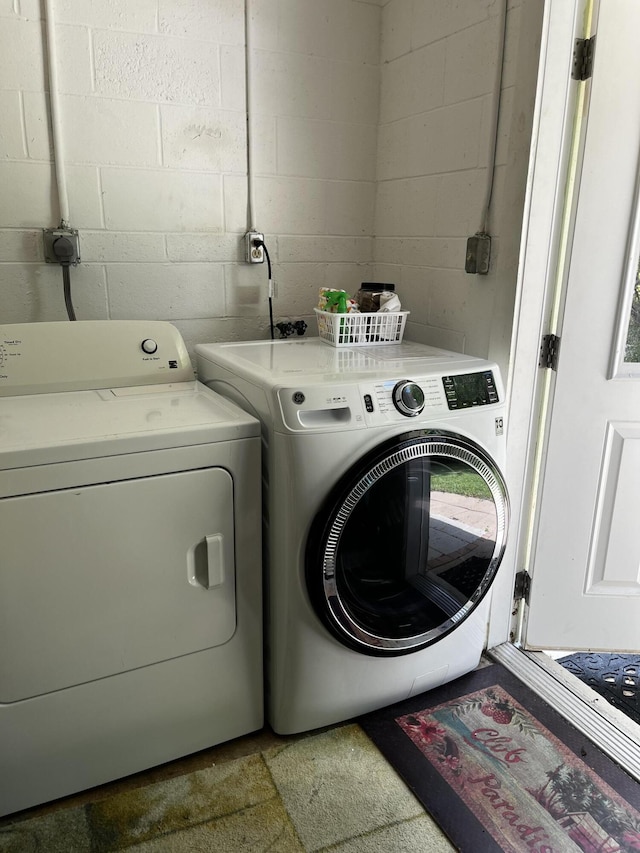 laundry room with separate washer and dryer