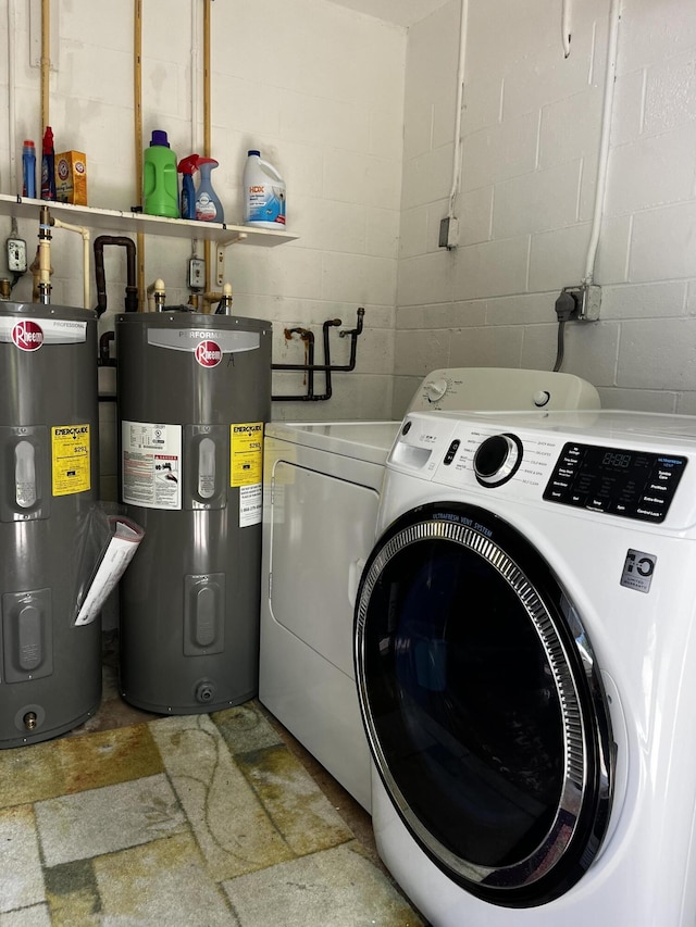 laundry room featuring water heater and washing machine and clothes dryer