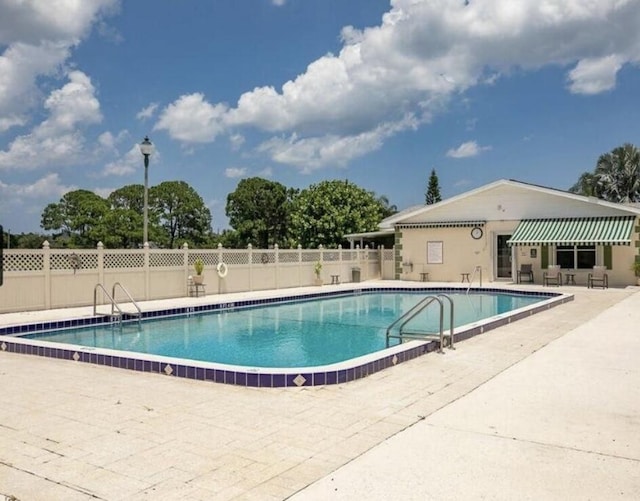 view of pool featuring a patio area