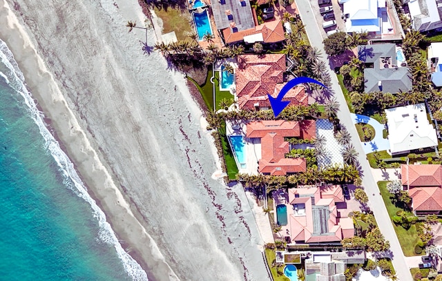 aerial view featuring a beach view and a water view