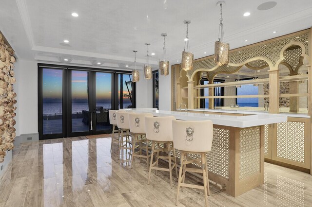 unfurnished room featuring baseboards, a tray ceiling, ornamental molding, and recessed lighting