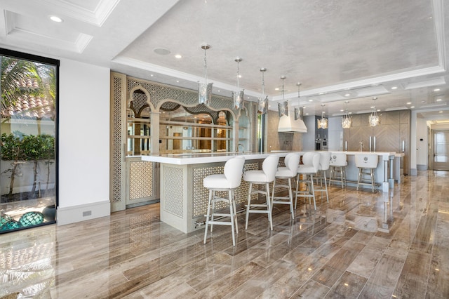 unfurnished room featuring ornamental molding, a wealth of natural light, a raised ceiling, and light wood finished floors