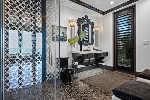 spare room featuring baseboards, a water view, a raised ceiling, and crown molding