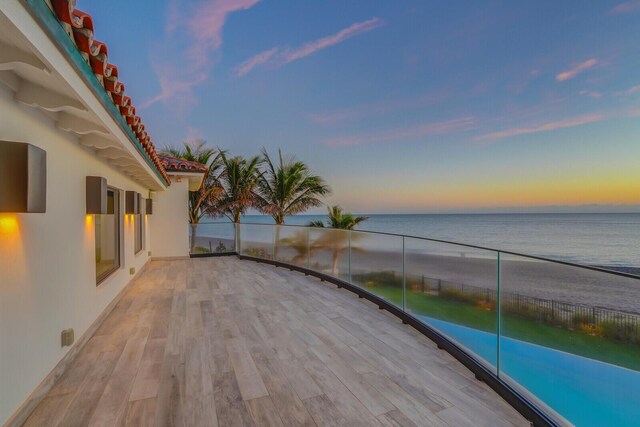 view of patio / terrace with a water view and a bar