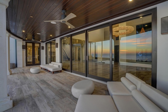 view of patio with an outdoor hangout area, french doors, and a ceiling fan