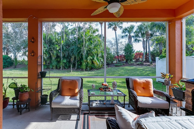 sunroom featuring a wealth of natural light and ceiling fan