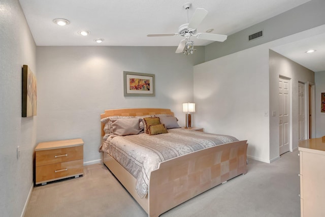 carpeted bedroom with ceiling fan and lofted ceiling