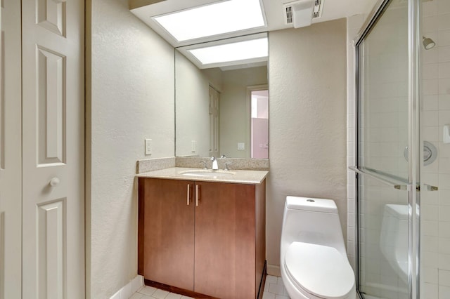 bathroom featuring vanity, toilet, and an enclosed shower