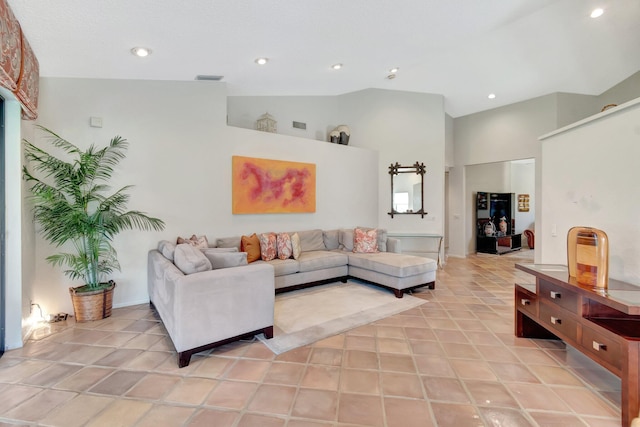 tiled living room with high vaulted ceiling